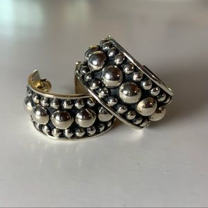 Moda Designs silver hoop earrings.